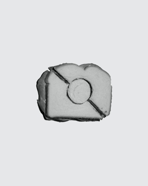 Black and white ham sandwich on solid background