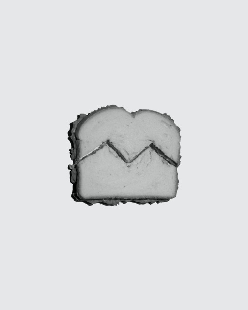 Black and white peanut butter sandwich on solid background